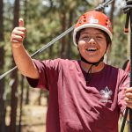 Participating in rope course activities